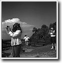 Gas mask tourist taking snapshot